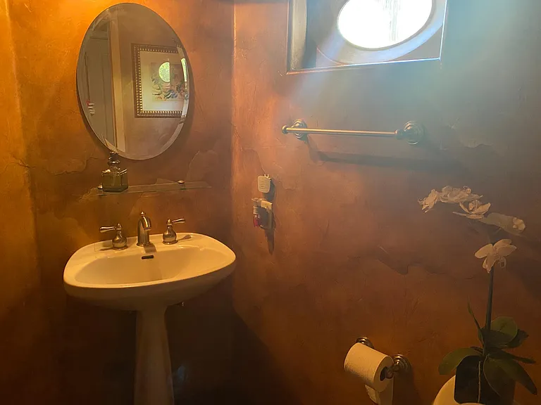 Powder room on the first floor by the laundry room