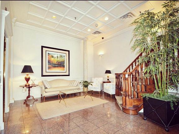 This is the main lobby you will enter into from the garage or front door accessible to all Queen's Gate tenants. With Elevator and Stairs