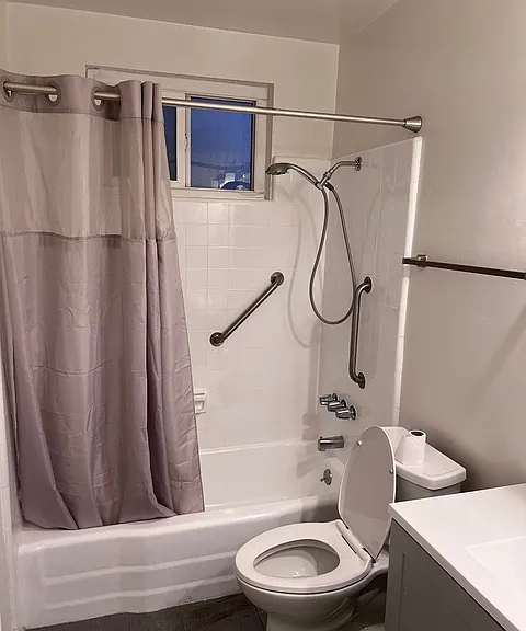 Very clean, refurbished shower tub and newer toilet