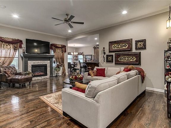 Hardwood continues through the family room, kitchen and dining area.