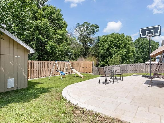 Enjoy the privacy fenced back yard with large patio and utility shed.