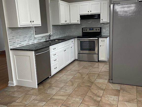 Kitchen with Granite counters and stainless steel appliances