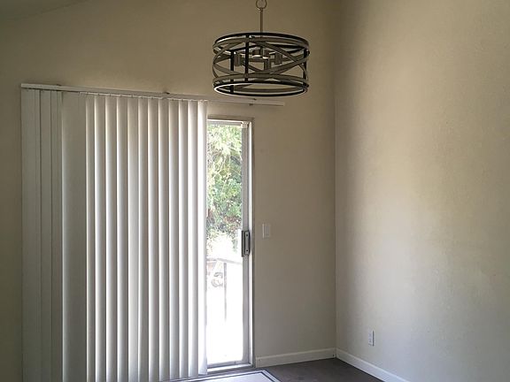 Formal Dining room with vaulted ceiling and sliding door to backyard