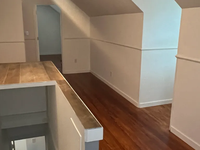 upstairs bonus room (with knee wall around stairwell)