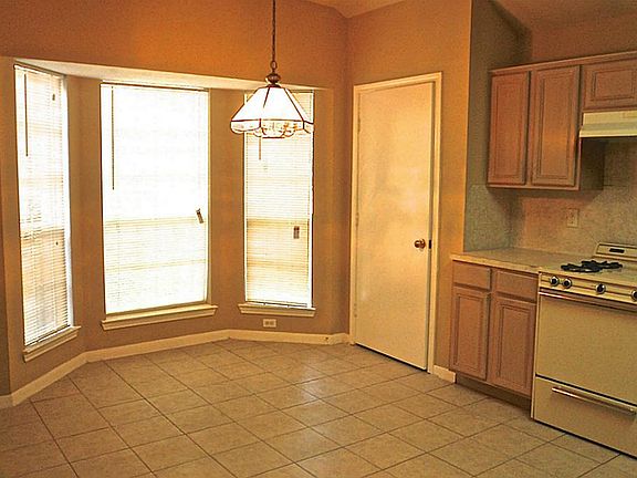 Bright and open kitchen with tons of cabinets