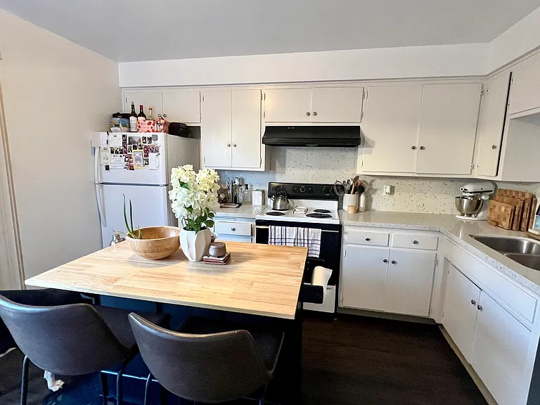 Furnished neighboring unit shown for kitchen layout reference