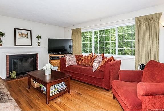 Large window in living room offers lovely views of private yard.