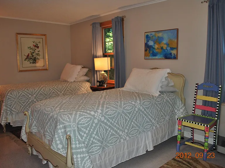 Second bedroom with two twin beds and full closet.