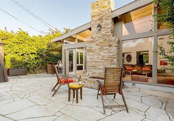 Step out to the stone patio with fire pit, gazebo and bar area