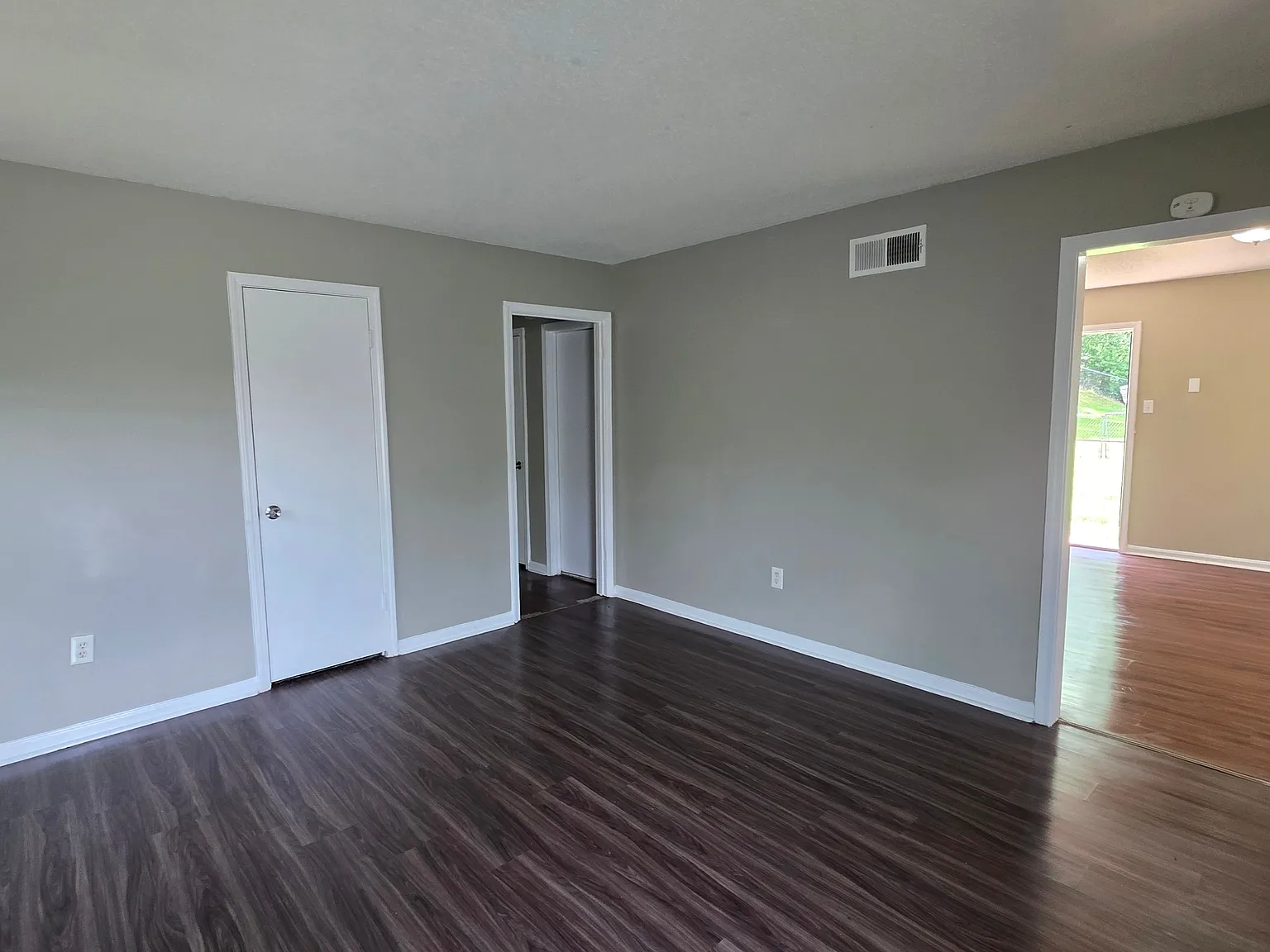 Cozy 4-Bedroom Brick Home with Front Porch Charm — Photo 3