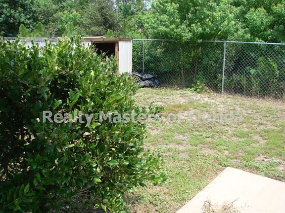 Fenced Yard & Small Shed