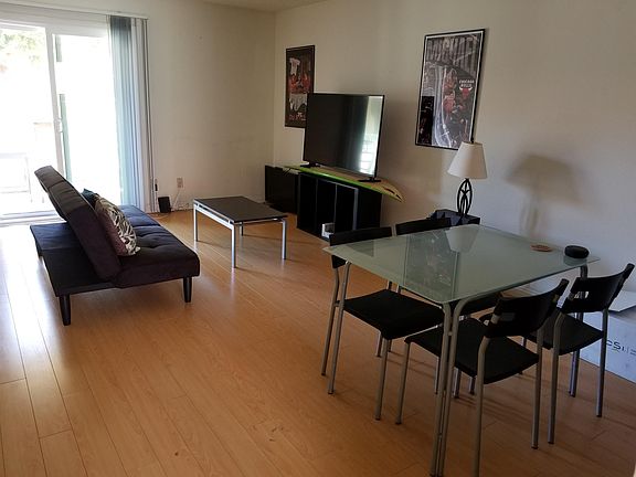 Family room and dinning area. TV is not included. Furniture may have changed.