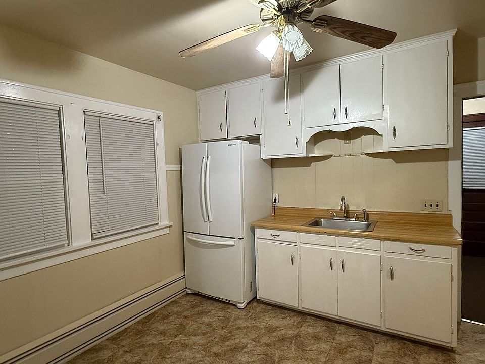 Kitchen, with pretty vintage cabinets and a nice new refrigerator