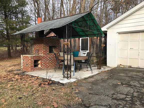 Patio - with pizza oven, table, chairs.