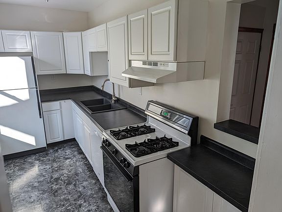 Kitchen with pass-thru to Entry Room