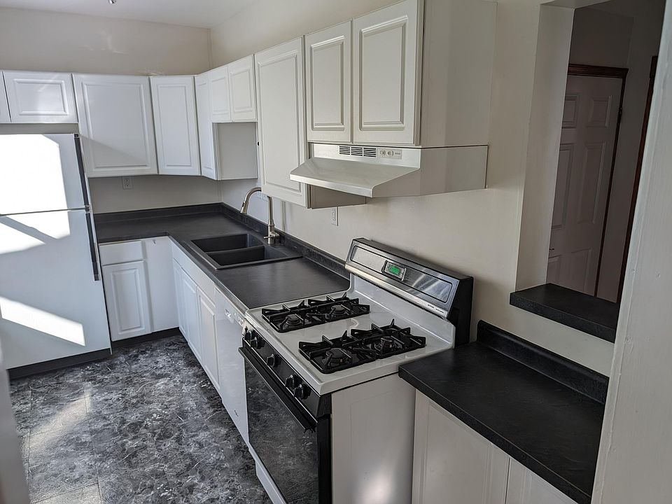 Kitchen with pass-thru to Entry Room
