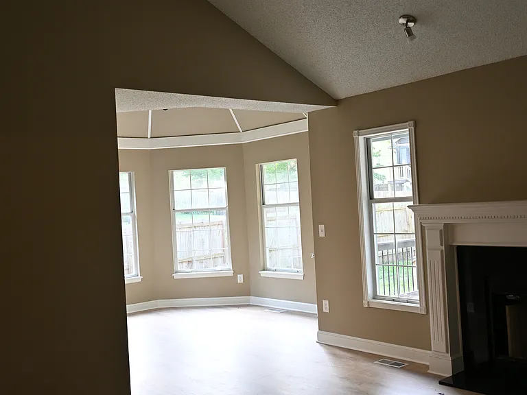Dining room with vaulted ceiling.