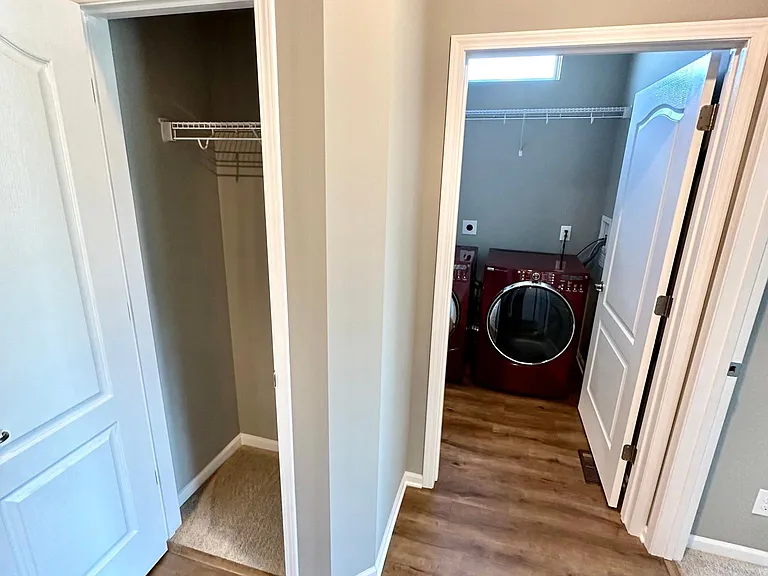 Hall closet and laundry room across from 2nd and 3rd bedrooms