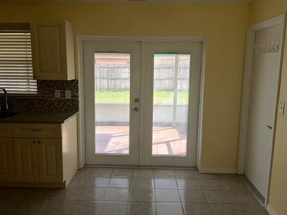 French doors leading to screened in back porch.