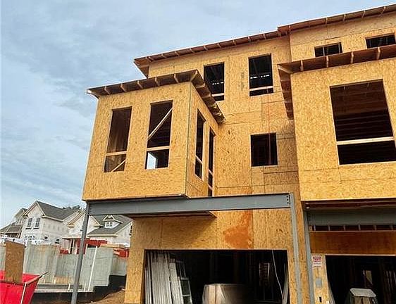 Drive under garage on rear. Bumped out sunroom and there will be a deck between the spacing.