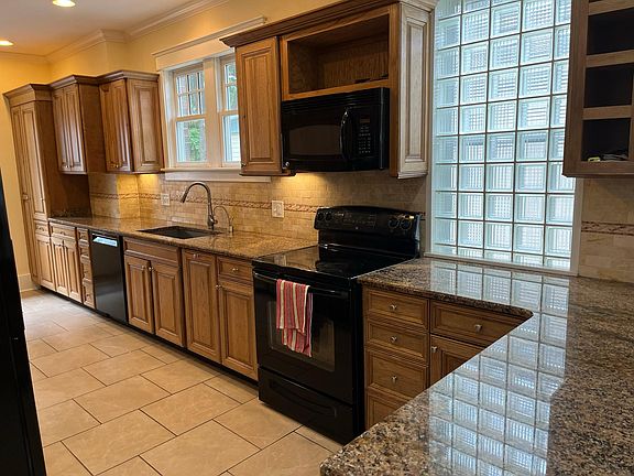 Large updated galley kitchen with lots of counter space. New refrigerator.