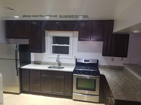 open kitchen with counter to breakfast bar