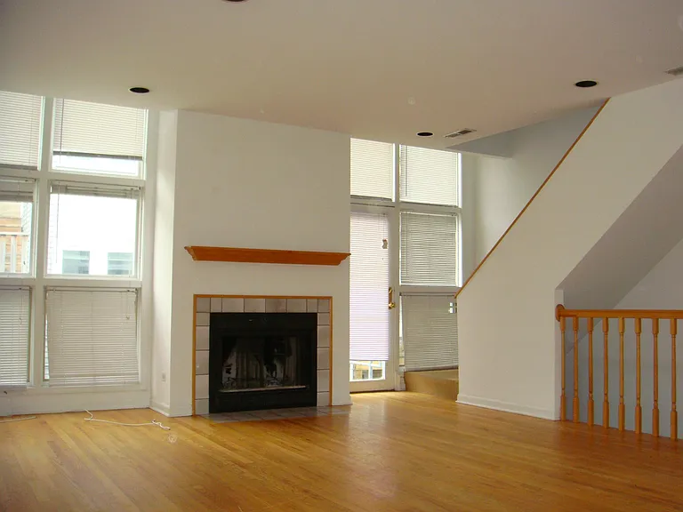 LIVING ROOM. WEST SUN WALL OF GLASS