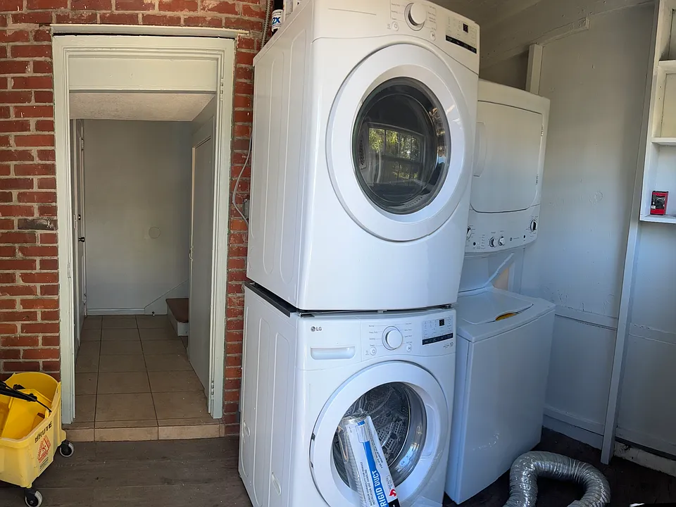 Utility room at the back of property next to parking.