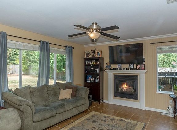 Fantastic great room concept with gas fireplace, custom blinds &