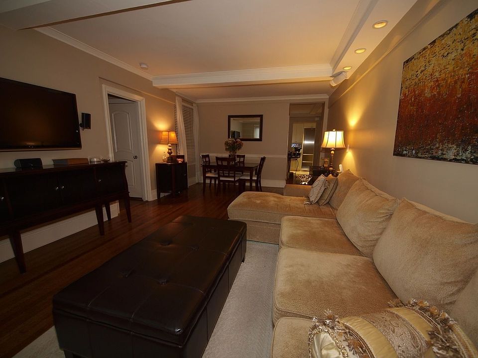 Living Room with custom remote controlled light soffit, 6 ch surround sound