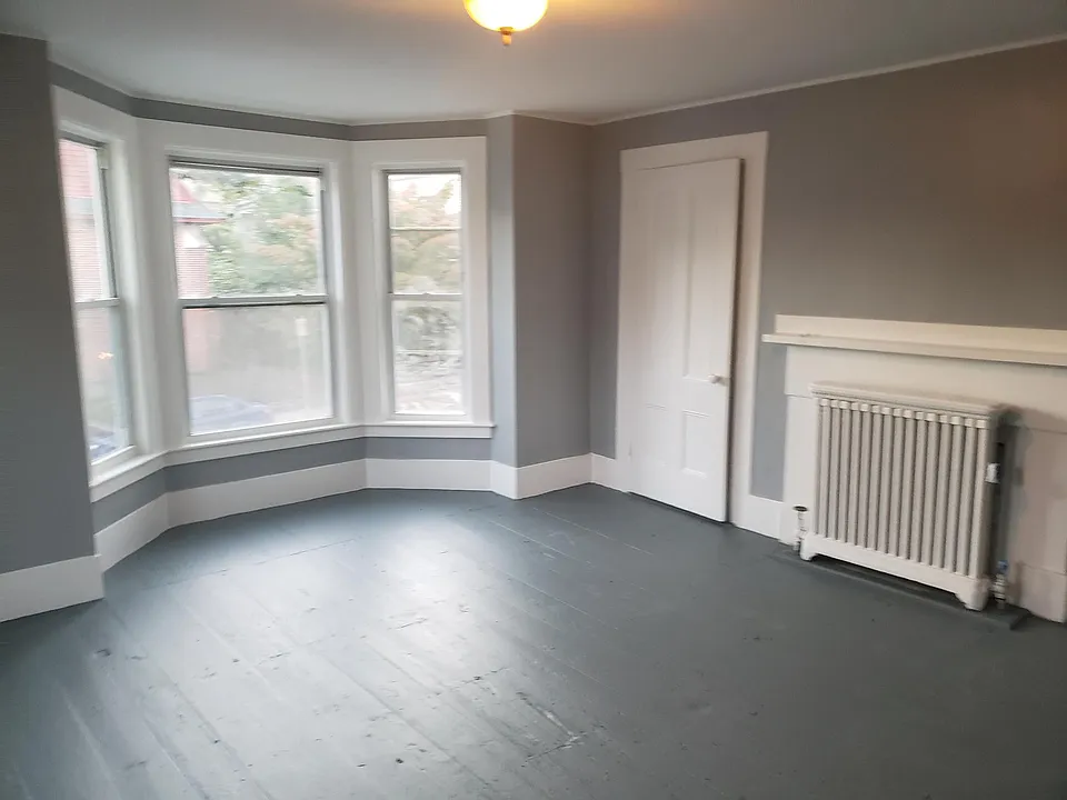 Modern pallete makes this over-sized bedooms welcoming!