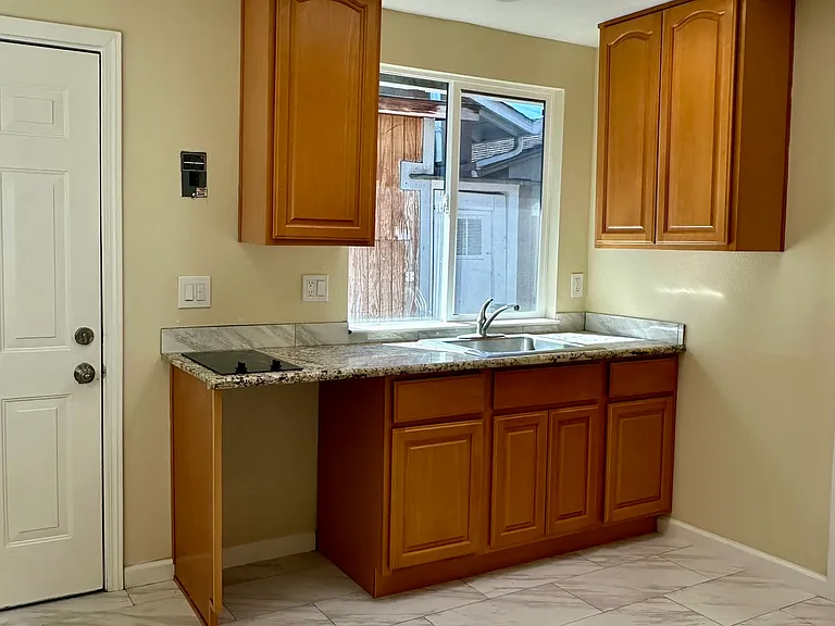 Kitchenette area with electric cooktop, recessed lighting and skylight