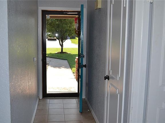 Foyer with coat closet.
