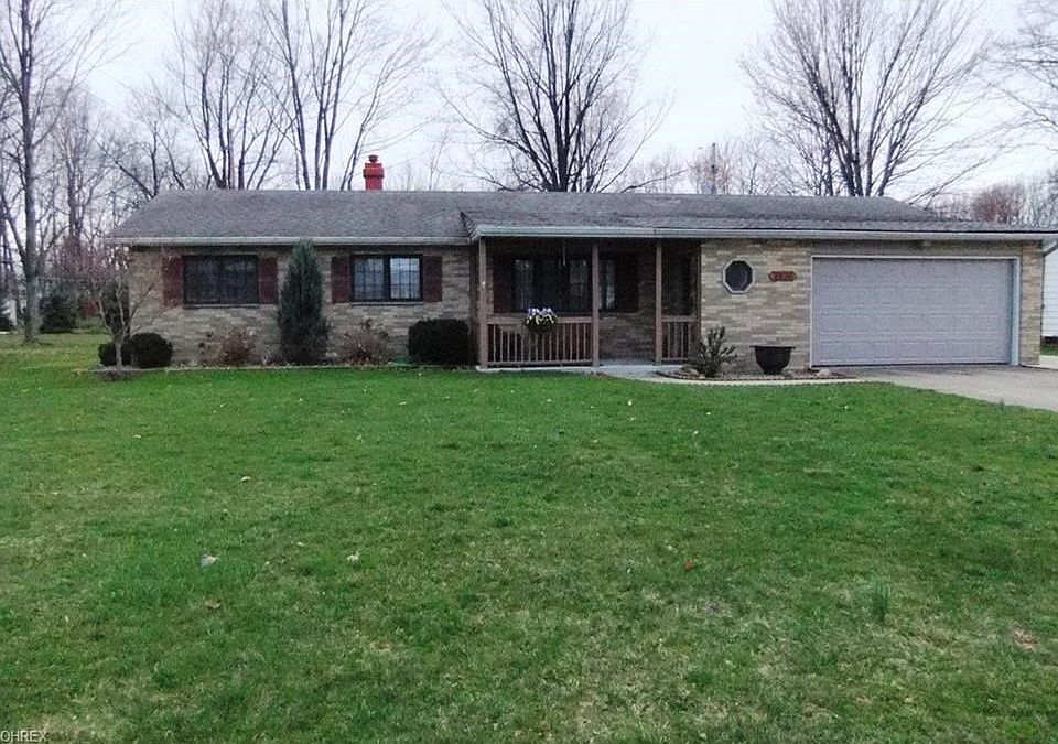 Front brick exterior with front porch and 2-1/2 car attached garage.