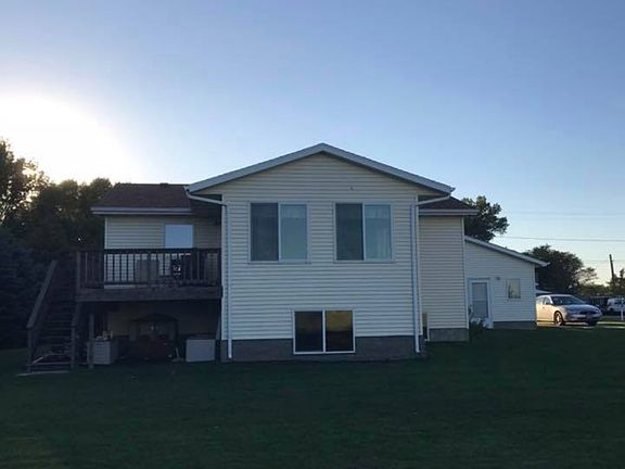 Back of house with deck