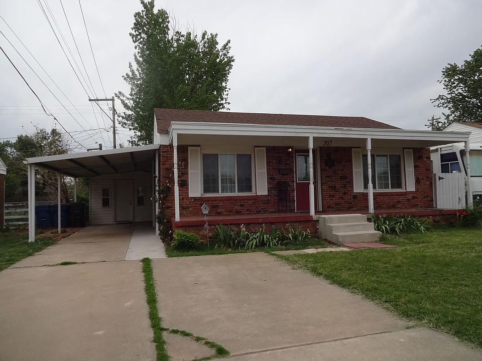 Front of house with carport