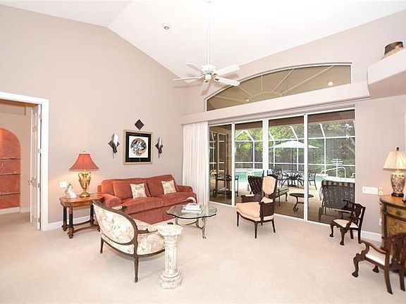 Formal living room with sliders to the screened lanai.