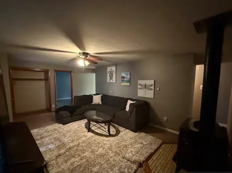 Extended lower-level layout offering multiple seating areas and flexible use of space.