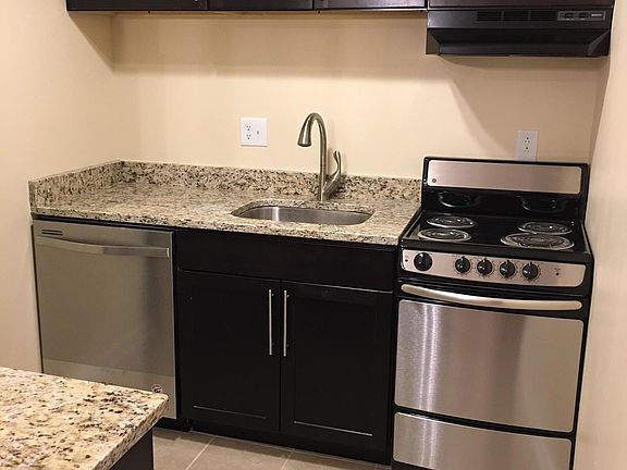 Renovated kitchen with new appliances, cabinets.