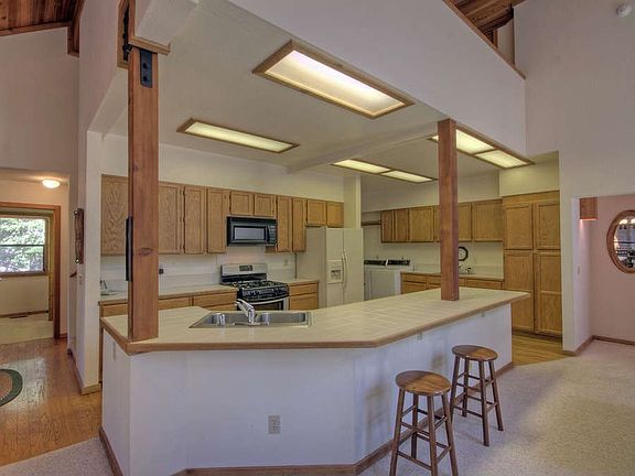 "Lots of cupboard and counter space plus breakfast bar"