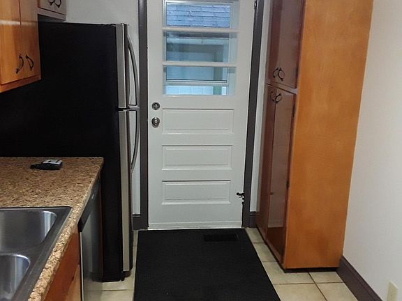 Looking at door from kitchen to outside/garage