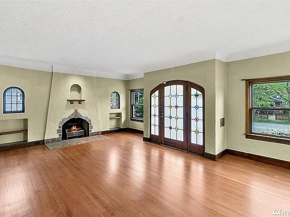 Living Room with wood burning fireplace. There is a gas hookup.