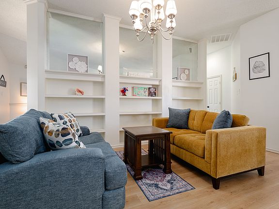 Reading nook with two couches and ample shelf space.