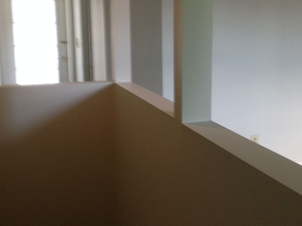 From the stairs into the bedroom and balcony door.