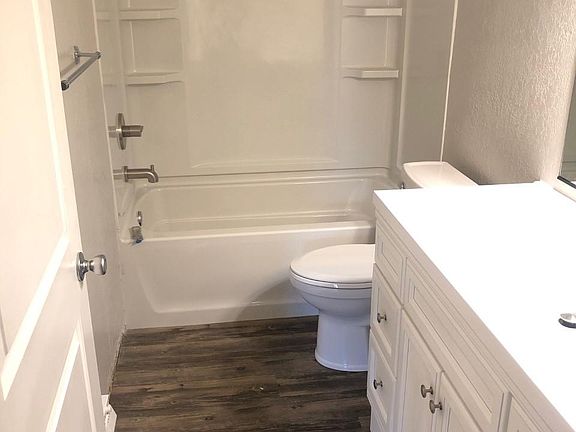 Updated bathroom with bathtub.