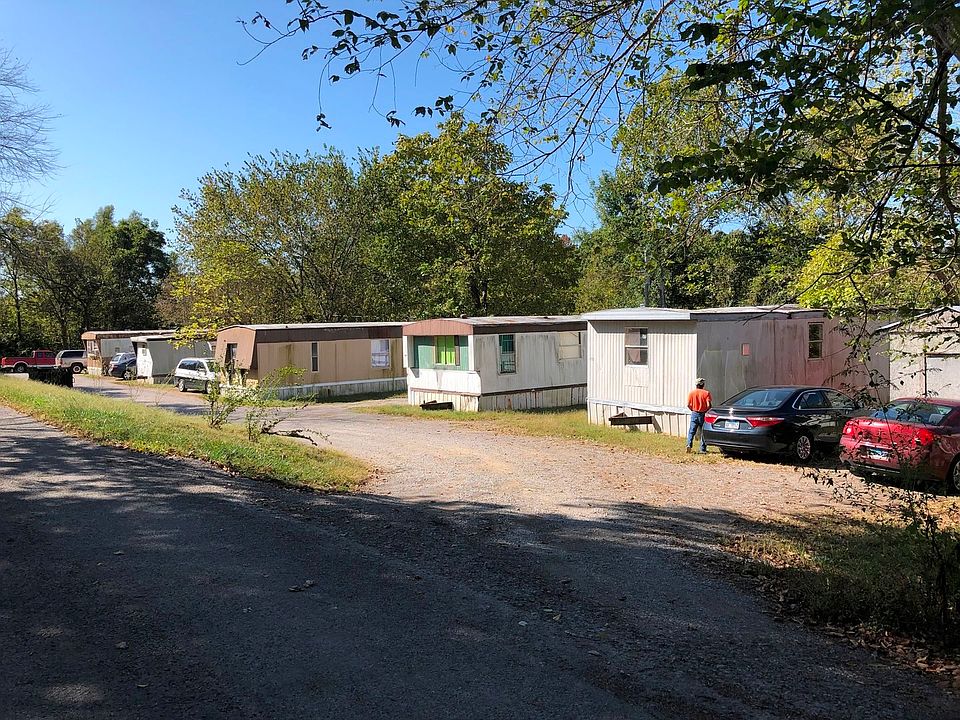 Street view of the MHP.  POH's are in decent shape and are habitable for new renters.