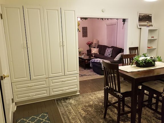pinkish lighting, the living room is actually white.
