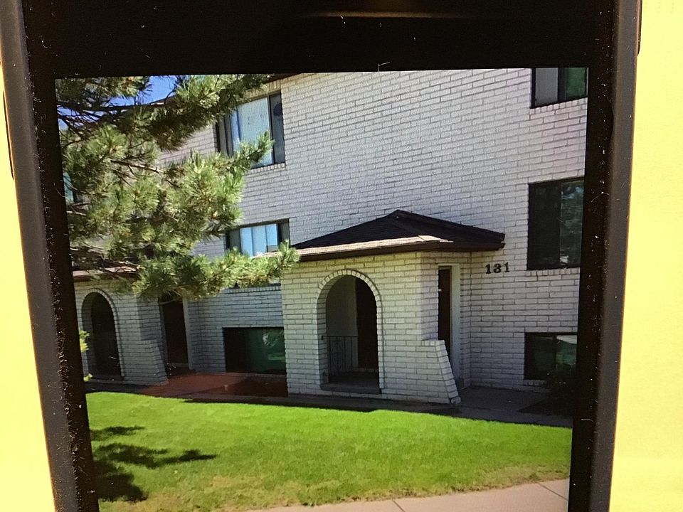 Third floor apartment in a solid white brick building on a quiet cul-de-sac.