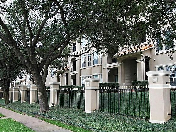 The property is well-kept and has lush landscape