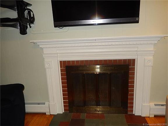 Fireplace in bright living ...